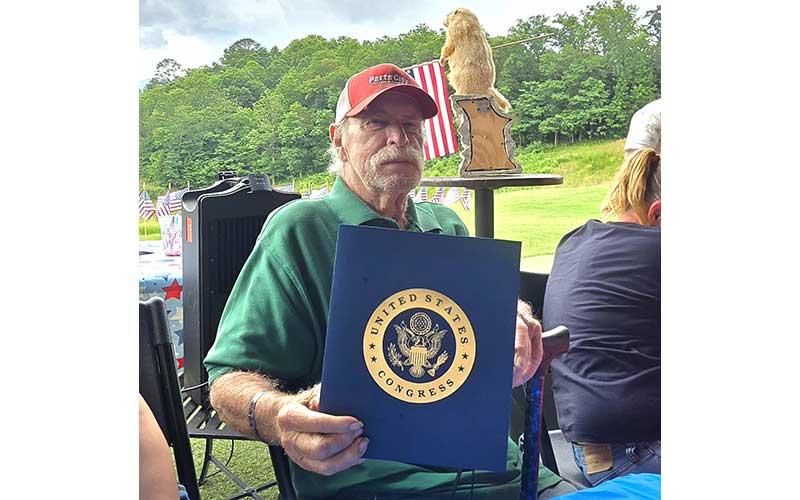 Photo/Sara Eisinger - US Navy Vet. Robert “Bob” Pillow receives formal, official tribute from Congressman Chuck Edwards, honoring the veteran's military service and serving as a permanent public record of his dedication to the country on Flag Day 2026, June 14.