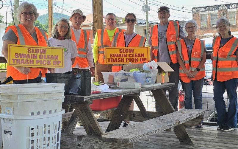 Swain Clean volunteers Cynthia Womble (left to right), MaryK Buranosky, Joe Buranosky, Thomas Womble, Stacy Miller, Ben Harrison, Jane Harrison and Valerie Ely gather at the riverside pavilion behind the Swain County Visitor Center and Heritage Museum June 20.