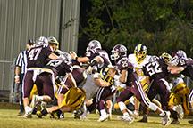 Swain Maroon Devils offensive line holds off the Murphy defense to give quarterback Damian Lossiah a path to the end zone. The game had strong defense on both sides with Murphy taking the win 15-14. 