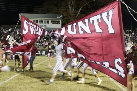 Devils burst through their sign on the field
