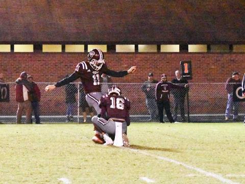 Photo by Joanna McMahan - Maroon Devil kicker and holder get ready to send the ball down the field.