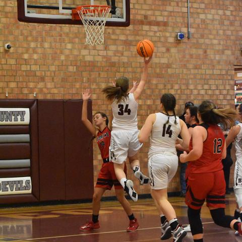 Swain County Lady Devil sophomore Angel Parsons scores in the season opener win against the Lady Wildcats. 