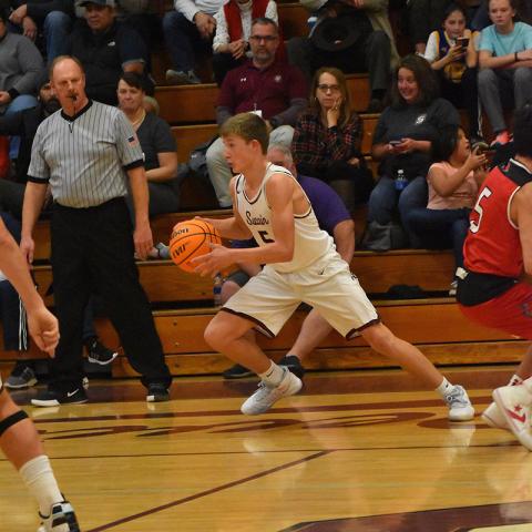 Maroon Devil Connor Hyatt advances the ball