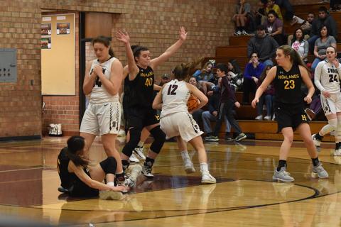 Swain Lady Devil Maddie Spates drives the ball toward the net in the home loss against the Lady Highlanders.