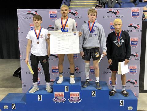 Jonas Trejo stands on the podium with the other athletes