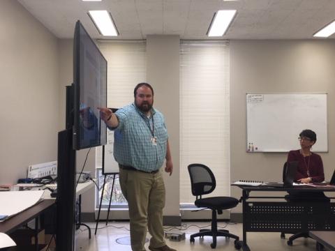 Dr. Brandon Sutton shows the board the School Decision Tree from the CDC