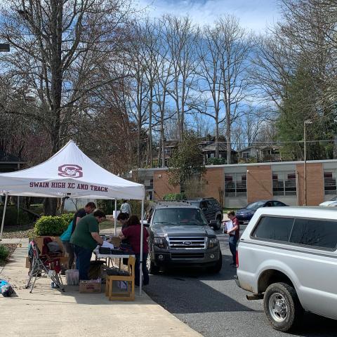 Staff hands out laptops at Swain Middle