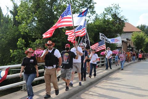 March down Everett Street sidewalk