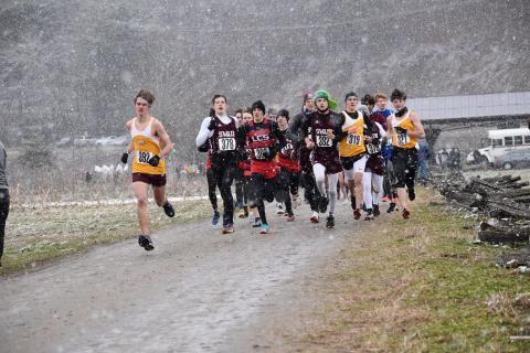 Swain County Maroon Devils cross country team is pictured with other competing teams at the regional match held Saturday at Kituwah Mound amid cold temperatures, wind and snow.