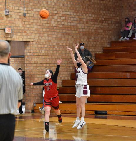 Lady Devil Amaya Hicks makes a 3 point shot in the home win against Andrews Saturday.