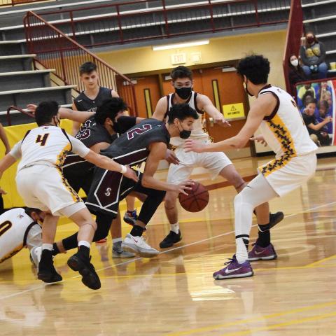 The away game against Cherokee on Friday was a physical game. Pictured, Maroon Devils Judaiah Littlejohn (2) and Carson Taylor (23) fend off Braves players for control of the ball.