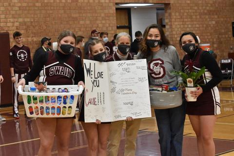 Lady Devils Cheerleaders Tsini McCoy and Isabella Garcia organized the surprise thank you to athletic trainer Carrie Powell that included a huge Valentine’s card with signatures, a basket of goodies and a house plant. The gifts were presented at halftime last Thursday. 