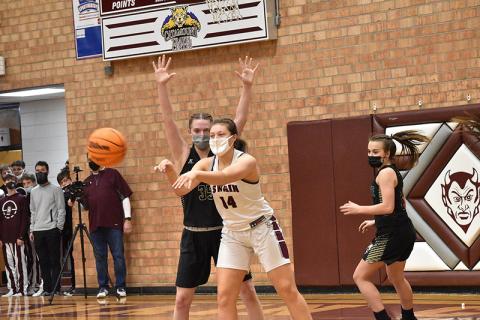 Lady Devil Savannah Smith makes a successful pass in the home win against Hayesville. 
