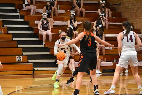 Lady Devil Mazie Helpman drives the ball in the home game against Rosman