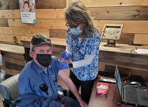 Mark Hyatt, owner and operator of Mark’s Garage in Bryson City, received a vaccine earlier this month from the Swain County Health Department.