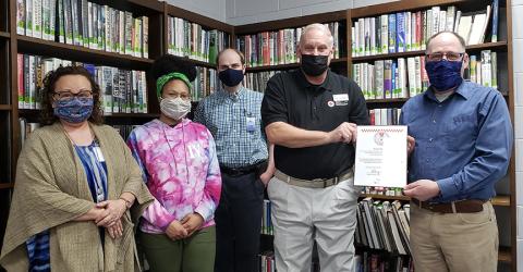 Pictured from left is library staff Bobbie Sue Smiley, Alexis Faciane and Benjamin Ossoff with American Red Cross representative John Clodfelter and Librarian Jeff Delfield.