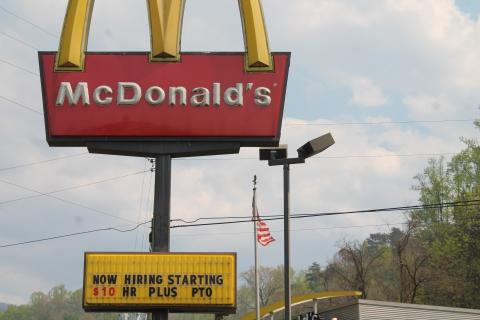 Fast food restaurants like McDonalds, pictured, are offering $10 or more an hour for new hires. 