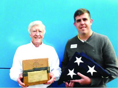 From left, David DeHart is holding the box that the flag was packed in and sent to the surviving spouse in May 1949 and Justin Kirkland holds a 48 Star American flag that he found and purchased at an Antique Auction House in Waynesville, several years ago.