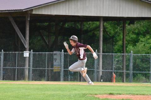 Photos by Joanna McMahan Maroon Devil Cooper Hyatt races to the next plate