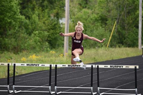 Jessica Lohmann clears a hurdler.