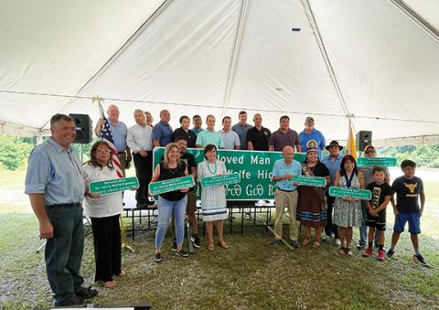 Eastern Band of Cherokee Indians tribal leaders unveiled the new sign for the new stretch of Highway 441 honoring respected elder and storyteller Dr. Jerry Wolfe