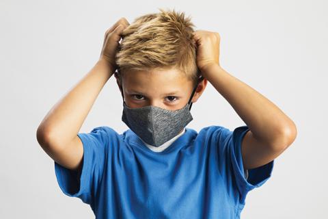 Kid putting on mask