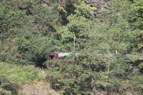 The train cars can be seen off the track Monday