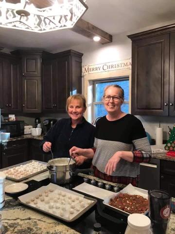 From left, Stephanie Rose and Ona Huskey making their famous Christmas candy.