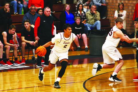 Maroon Devil Donnavin Groenewold looking for an opening to shoot through to the basket.