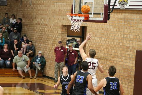 Isaiah Collins gets a basket in the winning game against the Mustangs