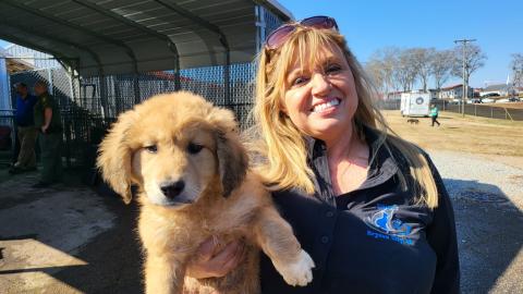 Beth Cline-Stroud with a puppy rescued in S.C.