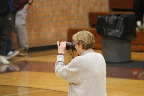 Joanna McMahan takes pictures at a SCHS basketball game