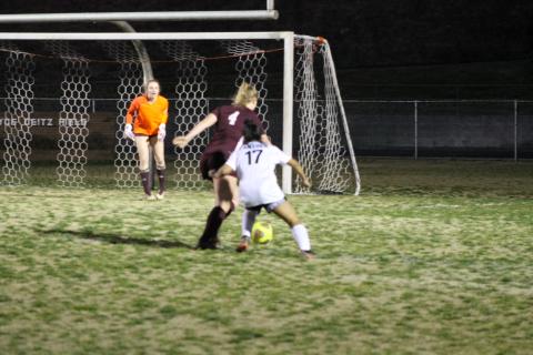 Anna Gray helps defend the Lady Devil turf during the season opener on Monday night. Gray was named Player of the Game. 