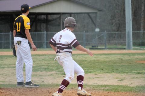 Senior Will Jenkins attempting to steal home from third base 