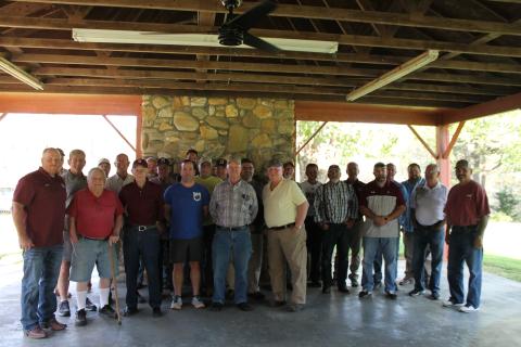 Past and present: Former Swain High School football head coaches and assistants gathered together to welcome the newly named head football coach, Sherman Holt (far left).