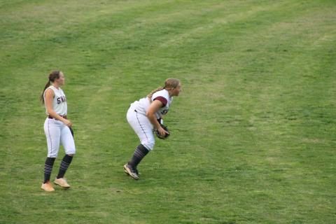 Faith Woodard gets a ground ball as Kiersten Smith backs her up