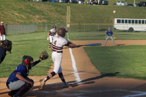 Reese Winchester is up to bat, as Cooper Hyatt stares down home plate from third base.