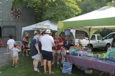 People shop from local crafters at the market