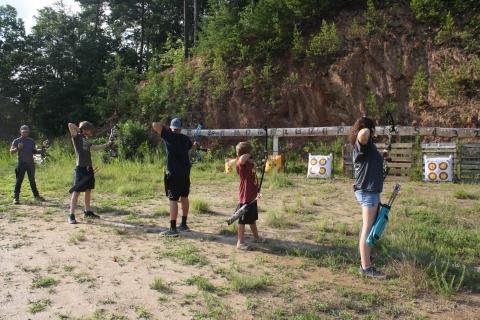 (From left) Kory Ledford, Kadin Taylor, Marcus Fisher, Xander Litzau, and Kianna Parton shoot from the 10-yard line. Archers pictured range in age from 9-16.