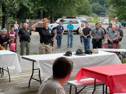 Swain County Probation Officer Melissa Massie pays respect in the Table of Honor Ceremony.