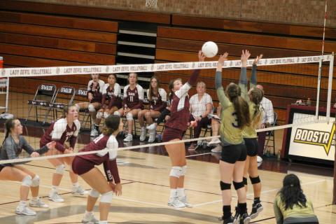 Kennedy Anthony taps the ball over the net at the home game against Hayesville last week.