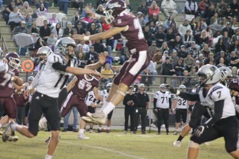 Cole Wikle soars over a Robbinsville player in a catch attempt.