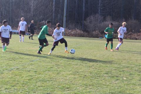 Maroon Devil Kale Stephenson fends off a Bobcat player.