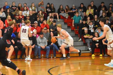 Maroon Devil Joshua Collins drives the ball up the court.