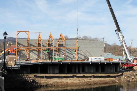 Timber framing going up at the building owned by Rollon and Sherry Smith next to Everett Street bridge was drawing attention this week.