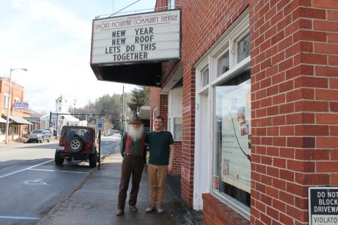 Smoky Mountain Community Theatre repairs liaison Tim Hall (left) stands with theater Board of Directors President Ricky Sanford outside the iconic downtown location, which recently had roof repairs finished.