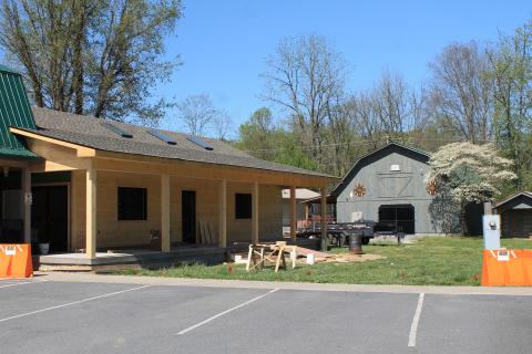 The Fly Fishing Museum of the Southern Appalachians is moving to its new location on Island Street to open next month. The new building, pictured above, is modeled after a log cabin and was built by county workers.