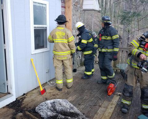 Commissioners are considering the need for more firefighters in the county. Pictured, Bryson City and other local departments responded to a house fire earlier their year.