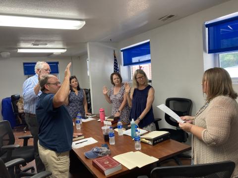 Swain County Clerk of Courts Misti Jones (right) led each of the new members in the swearing-in ceremony, held at the BOE office. The board includes from left Jeramy Shuler, John Herrin, Hannah Smith (chairwoman), Frances “Nannett” Powell and Mary K Buranosky.