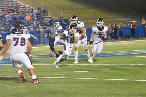 Maroon Devils Leland LeQuire (from left), Andrew Cody and Josh Collins make plays and try to keep the ball in the team’s hands during the Aug. 25 game against Smoky Mountain. The Devils won the game 14-10.